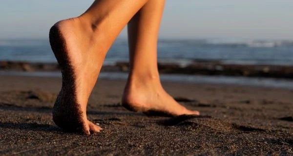 close-up-feet-black-sand-bali